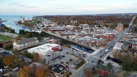 Aerial-view-of-small-Ontario-town-next-to-a-lake-in-fall