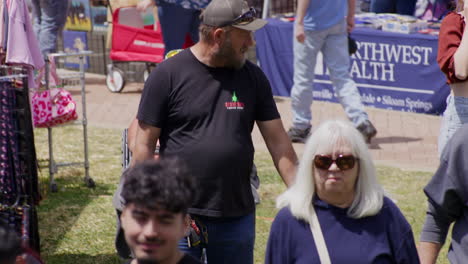People-Wandering-Around-Stalls-At-The-Dogwood-Festival-In-Siloam-Springs,-Arkansas