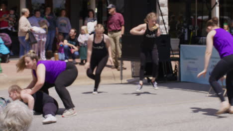 Young-Girls-Dancing-Under-The-Sunlight-At-The-Dogwood-Festival-In-Siloam-Springs,-Arkansas
