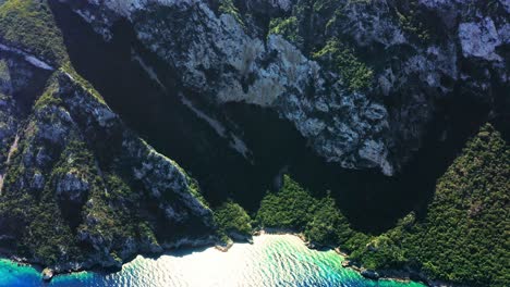 Scenic-aerial-view-of-sheer-mountain-cliffs-at-Aegean-seaside-of-Turkey