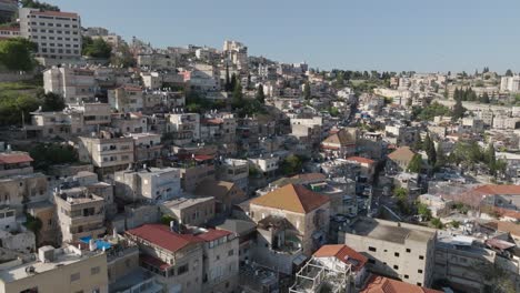 Crowded-apartment-buildings-on-hillside-of-old-town-Nazareth,-Israel