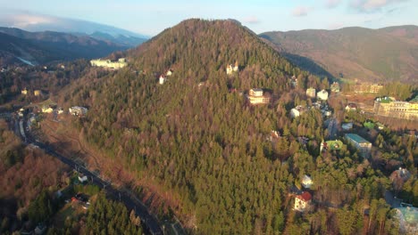 semmerling-mountain-drone-in-sunny-weather,-Austria-nature-forest,-village-on-the-hill,-austrian-castle-and-houses