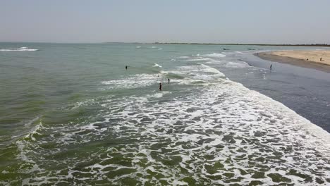 Aerial-Push-in-view-of-waves-crashing-on-the-beaches-of-Cape-Point,-The-Gambia