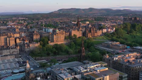 Wide-aerial-view-of-Edinburgh-center,-Gatehouse-Edinburgh-castle,-Waverley-train-station