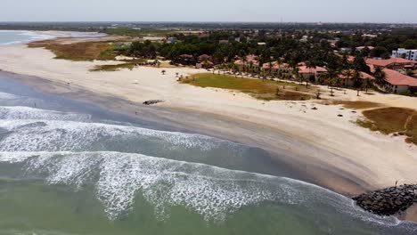 Aerial-view-of-shoreline-at-Cape-Point,-Bakau---The-Gambia-Pan-right