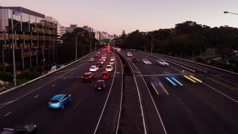 A-day-to-night-holy-grail-timelapse-of-the-traffic-driving-on-the-motorway-in-Wellington,-New-Zealand