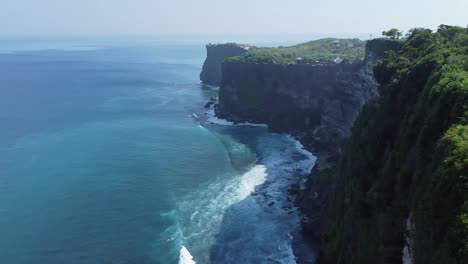 Aerial-drone-footage-showcases-the-stunning-beauty-of-Karang-Boma-Cliff-in-Uluwatu,-Indonesia