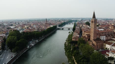 Aerial-view-of-the-Palazzo-della-Ragione-tower-overlooking-the-Arno-River-in-Verona,-Italy