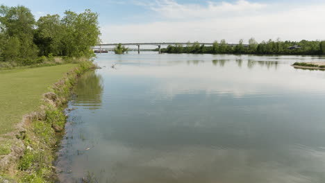 Reflections-On-The-Waters-Of-Arkansas-River-Near-Lee-Creek-Park-In-Van-Buren,-Arkansas