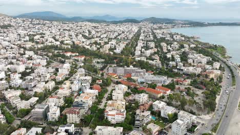 Drone-flyover-waterftront-Glyfada-cityscape,-Greece