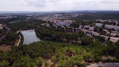 Aerial-View-of-Hauts-de-Massane,-Montpellier:-The-Lez-River-and-Pic-St-Loup-Mountains-in-the-Breathtaking-Background