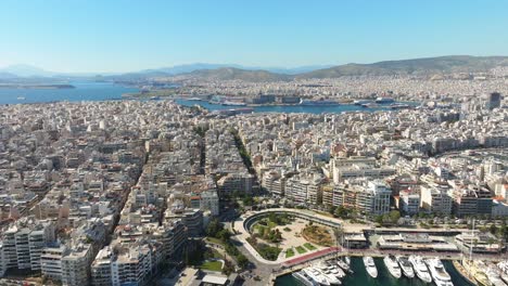 Aerial-wide-view-of-Zeas-Marina-with-Sprawling-Piraeus-cityscape,-Athens