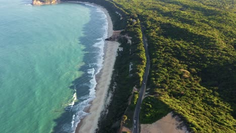 Extreme-wide-aerial-drone-birds-eye-top-view-shot-of-the-famous-tropical-Northeastern-Brazil-coastline-with-turquoise-beaches-surrounded-by-cliffs-and-exotic-foliage-near-Pipa-in-Rio-Grande-do-Norte