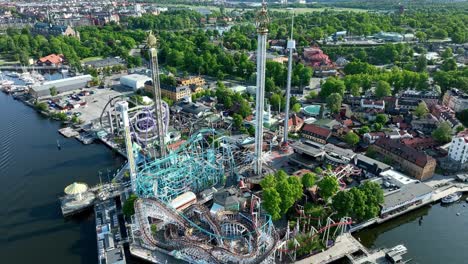 Aerial-rise-over-roller-coasters-Grona-Lund-amusement-park-in-Stockholm-Sweden