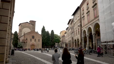 Slow-motion---Group-of-tourists-walk-along-piazza-santo-stefano-on-overcast-day
