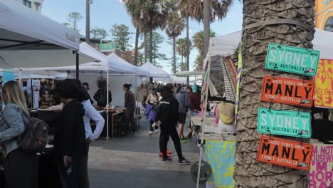 Signs-on-a-tree-at-Manly-markets-in-Sydney,-Australia