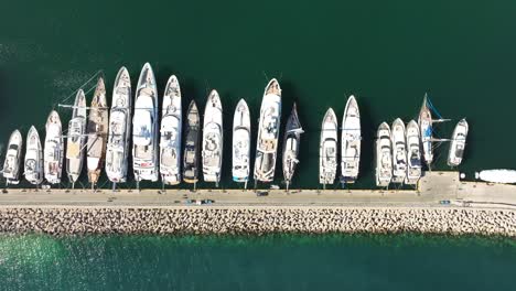 Aerial-topdown-view-over-Yachts-anchored-in-the-pier-of-Marina-Zeas,-Greece