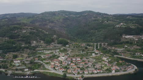 Aerial-perspective-of-the-city-of-baião-with-the-majestic-aqueduct-in-the-background-in-Baião-crossing-the-Douro-river-in-Portugal