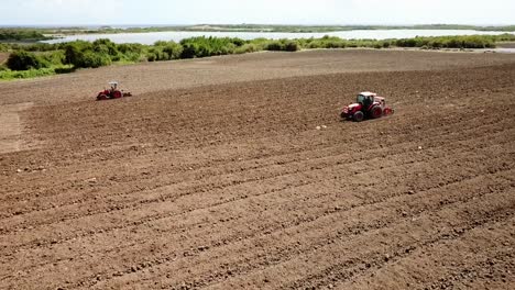Tractor-plowing-a-field,-filmed-with-a-drone,-Martinique