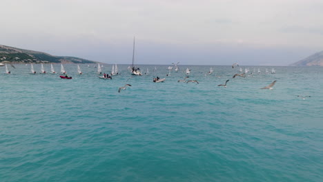 Idyllic-Seascape-With-Sailing-Boats-In-Baska,-Krk,-Croatia---aerial-drone-shot