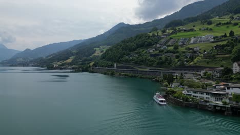 Grand-cruise-ship-docking-at-serene-shore-of-Weesen,Switzerland