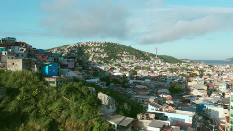 Flyover-establishing-over-a-small-favela-of-Arraial-do-Cabo-Brazilian-Caribbean-Brazil-on-a-cloudy-day-tropical-paradise