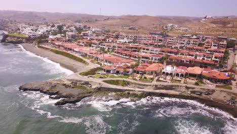 View-from-a-drone-flying-away-from-rosarito-condominiums-in-Baja-California,-Mexico