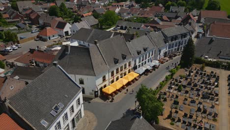 Drone-shot-over-Thorn,-Maasgouw-in-Limburg-over-the-Pancake-House-bakery-with-view-of-the-historic-Dutch-buildings