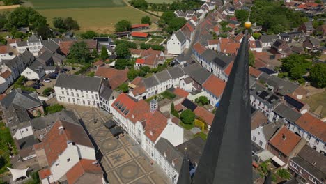 Overflight-with-drone-over-the-stately-Limburg-Abbes-Church-in-Thorn,-Maasgouw,-Wijngaard