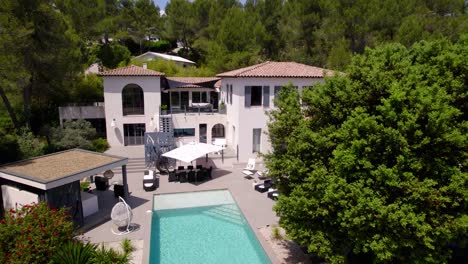 Aerial-revealing-shot-of-a-luxury-countryside-villa-in-the-south-of-France