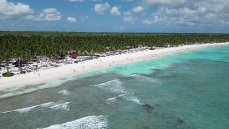 Aerial-landscape-shot-of-the-vacational-touristic-beach-at-Saona-Island-in-the-Dominican-Republic-during-a-sunny-day