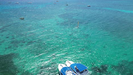 Drone-shot-of-several-boats-neaer-the-coast-of-Bayahibe-in-Dominican-Republic