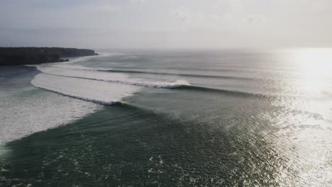 Uluwatu-bali-island-surf-famous-spot-destination-aerial-view-at-sunrise-with-huge-ocean-waves