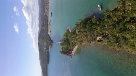 Vertical-drone-shot-of-Los-Puentes-Bridge-in-Samana-during-sunny-day,-Dominican-Republic---aerial-establishing-shot