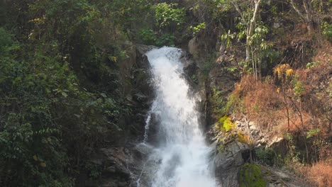 Tropical-waterfall-detail:-Narrow-stream-tumbles-over-jungle-cliff