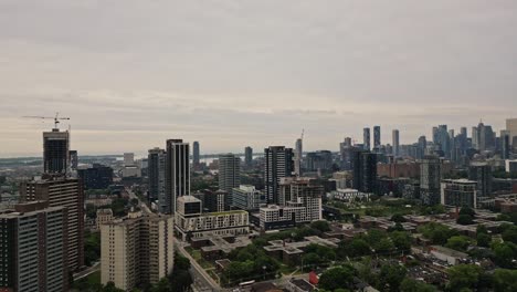 Aerial-View-Of-Under-Construction-Buildings-And-City-Skyline-On-A-Cloudy-Day