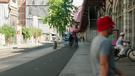 People-biking-next-to-the-Antwerpen-Centraal-railway-station---Antwerp,-Belgium