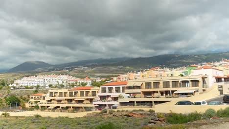 Resort-vacation-buildings-establishing-panning-shot-in-Adeje,-Tenerife