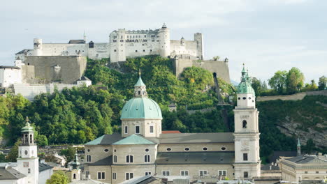 Static-shot-of-salzburg-austria-castle-above-hillside-overlooking-city-center