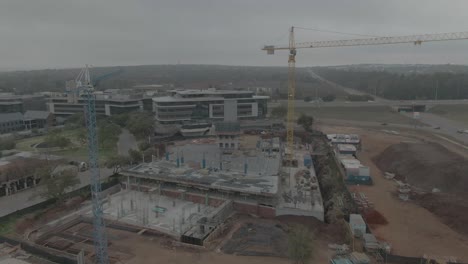 Drone-aerial-of-building-site-with-two-cranes-on-site