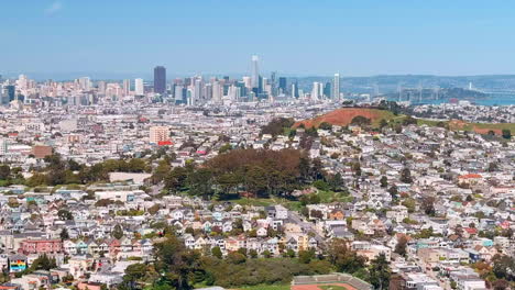 San-Francisco-neighborhood-near-Bernal-Heights-looking-toward-the-city-skyline---aerial-flyover
