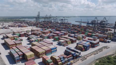 Aerial-view-around-containers-at-the-Caucedo-Port,-in-sunny-Boca-Chica,-Dominican-Republic