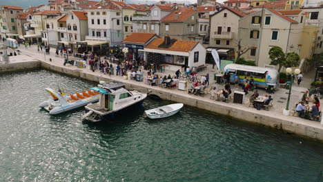 People-Relaxing-At-The-Cafe-In-Krk-Town-Harbour-On-Croatian-Island