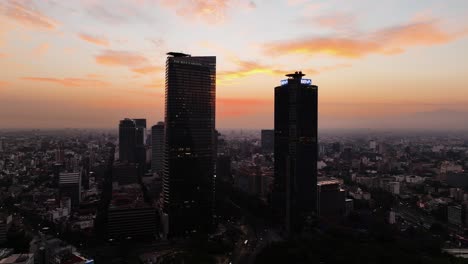 Aerial-view-over-the-Ritz-Carlton-and-the-BBVA-high-rise,-dusk-in-Mexico-city