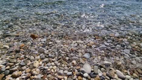 Closeup-Of-Kinira-Beach,-Pebble-Beach,-Crystal-Clear-Water,-Waves-Splashing,-Thassos-Island,-Greece,-Europe