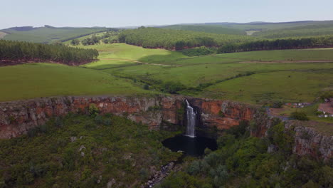 South-Africa-aerial-drone-Lisbon-Falls-waterfalls-Sabie-cinematic-Kruger-National-Park-partially-cloudy-lush-spring-summer-green-stunning-river-landscape-bush-forward-pan-up-movement