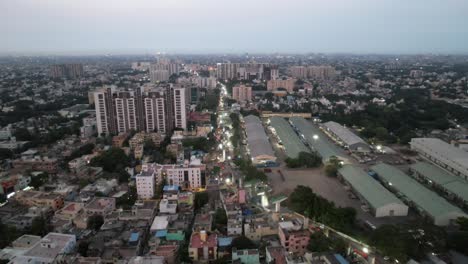 An-evening-aerial-view-of-Chennai-City's-crowded-neighborhood-reveals-the-city's-metro-rail-construction-and-warehouses