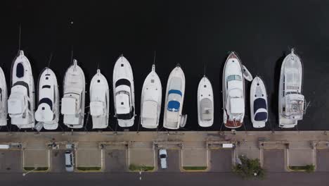 zenithal-aerial-view-of-yachts-parked-at-private-pier