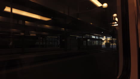 Passenger-point-of-view-from-the-interior-of-a-train-leaving-an-empty-Union-Station-in-Toronto