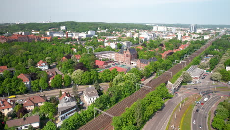 Backward-drone-overflying-the-district-of-Wrzeszcz-in-Gdansk-with-a-view-of-the-Gdansk-University-of-Technology-and-the-city's-transport-hubs
